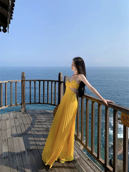 French dopamine holiday style yellow suspender dress female summer seaside sexy backless atmosphere long skirt