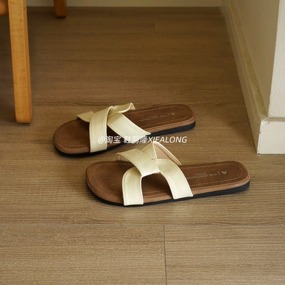 French-style minimalist flat slide sandals for women—featuring a crossover strap design, suitable for casual outdoor wear, vacation, and the beach (2026 Summer New Collection).
