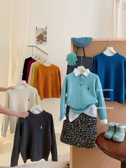Women's thick, cable-knit pullover sweater featuring embroidery; suitable for layering or wearing as an outer top, with a trendy Korean-style aesthetic.