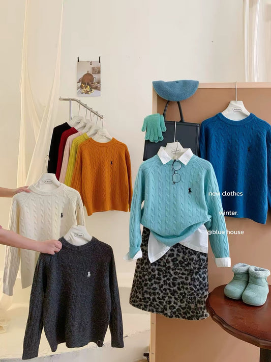 Women's thick, cable-knit pullover sweater featuring embroidery; suitable for layering or wearing as an outer top, with a trendy Korean-style aesthetic.