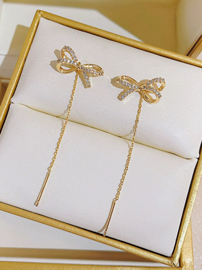 High-end golden bow earrings, long tassel earrings, elegant ear piercing earrings, 2023 new trendy women's thin