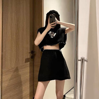 Xiaoxiang celebrity style black suit 2023 new pearl three-dimensional flower sleeveless short top A-swing skirt suit