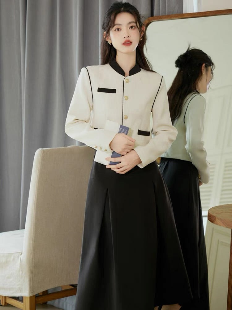 Autumn clothing is matched with a complete set of 2023 new stand-up collar long-sleeved tops and salt-style light and mature style skirts.