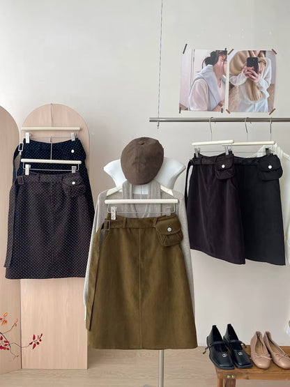 Japanese/Korean "Miu-style" retro polka-dot corduroy skirt (short-to-mid length) for women; versatile straight-cut A-line style featuring a waist bag—perfect for autumn and winter.