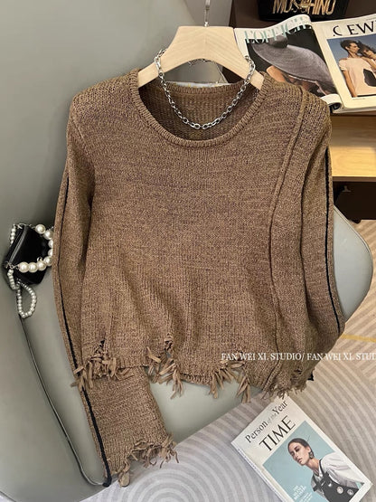 Autumn new hot girl hollow loose and versatile tassel shoulder pad pullover round neck long-sleeved sweater women's short top (B2213)