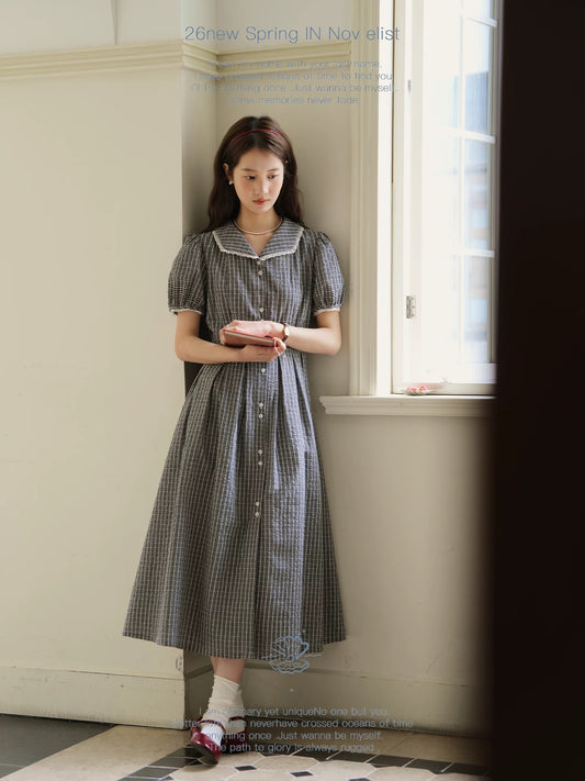 Nov elist One French-style black and white checkered shirt dress, mid-length, V-neck, slimming and flattering.