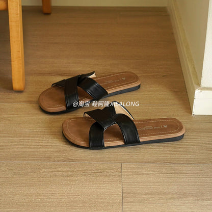 French-style minimalist flat slide sandals for women—featuring a crossover strap design, suitable for casual outdoor wear, vacation, and the beach (2026 Summer New Collection).