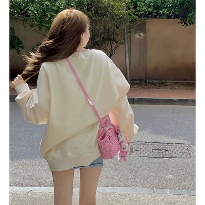High-end and super good-looking apricot color right shoulder sweatshirt 2023 autumn and winter velvet thickened round neck top for women