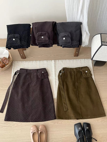 Japanese/Korean "Miu-style" retro polka-dot corduroy skirt (short-to-mid length) for women; versatile straight-cut A-line style featuring a waist bag—perfect for autumn and winter.