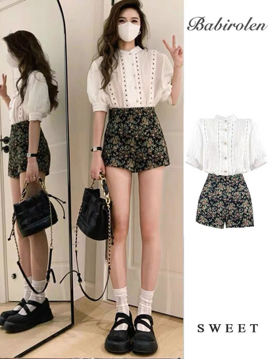 Summer French-style vintage outfit for petites: a slimming two-piece set featuring a floral skirt/shorts combo—combining a "pure yet sultry" vibe with a trendy, edgy look.