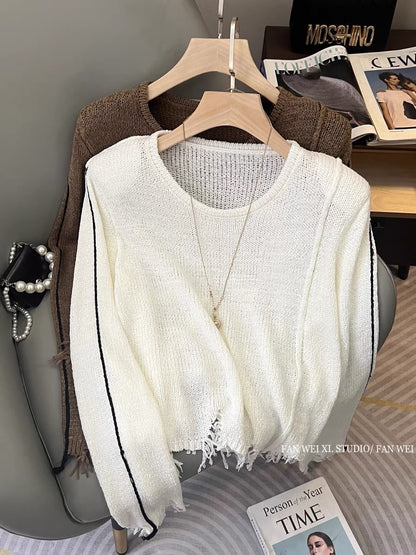 Autumn new hot girl hollow loose and versatile tassel shoulder pad pullover round neck long-sleeved sweater women's short top (B2213)