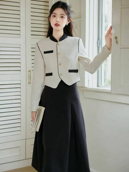Autumn clothing is matched with a complete set of 2023 new stand-up collar long-sleeved tops and salt-style light and mature style skirts.