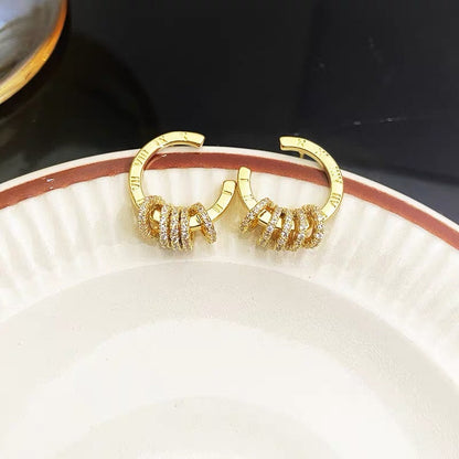 High-end Korean personality temperament earrings earrings golden zircon ring simple female earrings trendy small net red earrings