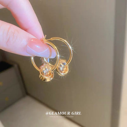 Real gold electroplating geometric twist winding circle earrings French fashion simple high-end sense earrings temperament earrings women