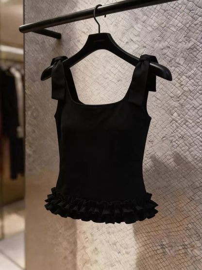 Stunning Korean-style black camisole featuring a bow-tie strap design and ruffled details—a chic, stylish top perfect for work or casual wear.