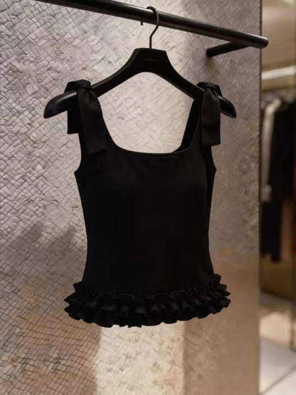 Stunning Korean-style black camisole featuring a bow-tie strap design and ruffled details—a chic, stylish top perfect for work or casual wear.