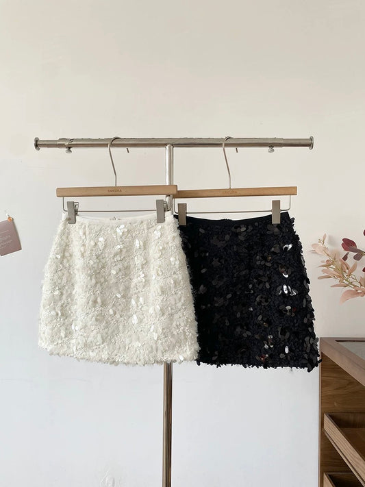 Korean style heavy-duty sequined high-waisted A-line skirt for women, 2025 winter new style, versatile black midi skirt.