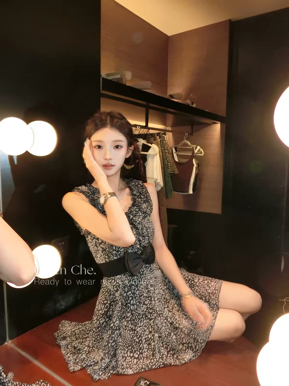 Chien: A black, waist-cinching chiffon dress featuring a mix of leopard and floral prints—evoking a "vintage heiress" vibe that balances innocent charm with alluring style.