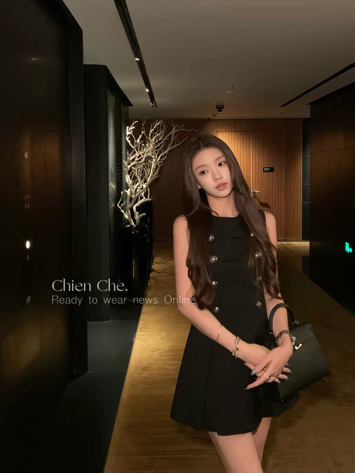 Chien "Napoleon Banquet" Collection: A sophisticated, sleeveless black dress featuring a vintage-inspired, "Chanel-esque" aesthetic and a refined, aristocratic flair.