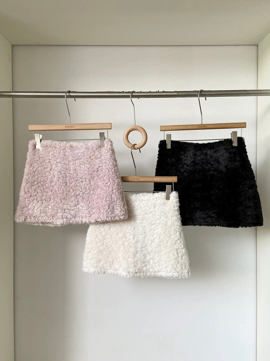 Faux lamb wool high-waisted thickened anti-exposure pink mini skirt for women, 2025 winter new Korean style versatile bodycon skirt