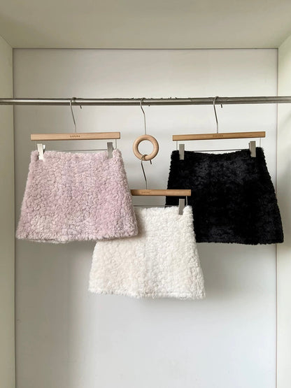 Faux lamb wool high-waisted thickened anti-exposure pink mini skirt for women, 2025 winter new Korean style versatile bodycon skirt