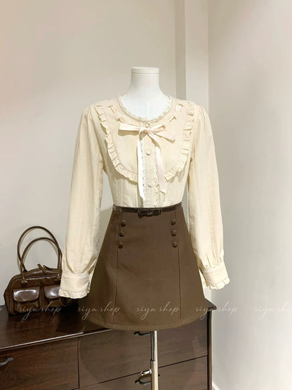 Liquor-filled toffee, apricot pink bow blouse with brown patchwork skirt, a complete autumn/winter outfit for women.