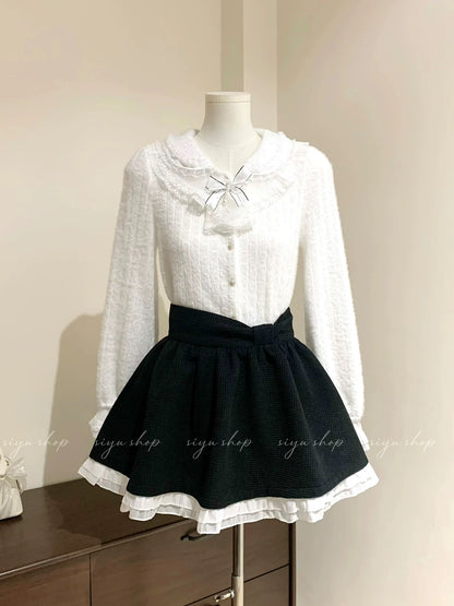 Fluffy milk cake style blouse with detachable bow tie, brushed lace, French court style, paired with a black tulle skirt.
