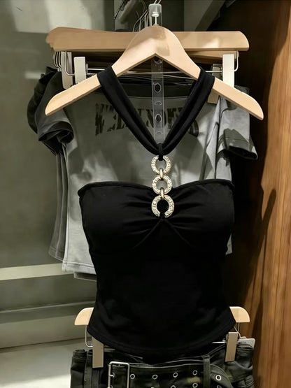 Korean-style black halter-neck tube top featuring cut-out and spliced detailing—a unique, slimming summer piece with a distinctive flair.
