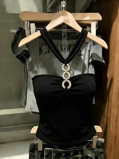 Korean-style black halter-neck tube top featuring cut-out and spliced detailing—a unique, slimming summer piece with a distinctive flair.