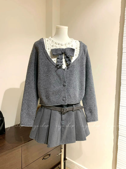 Heavy-duty beaded bow gray faux two-piece top + color-blocked woolen skirt set for elegant women in autumn and winter.