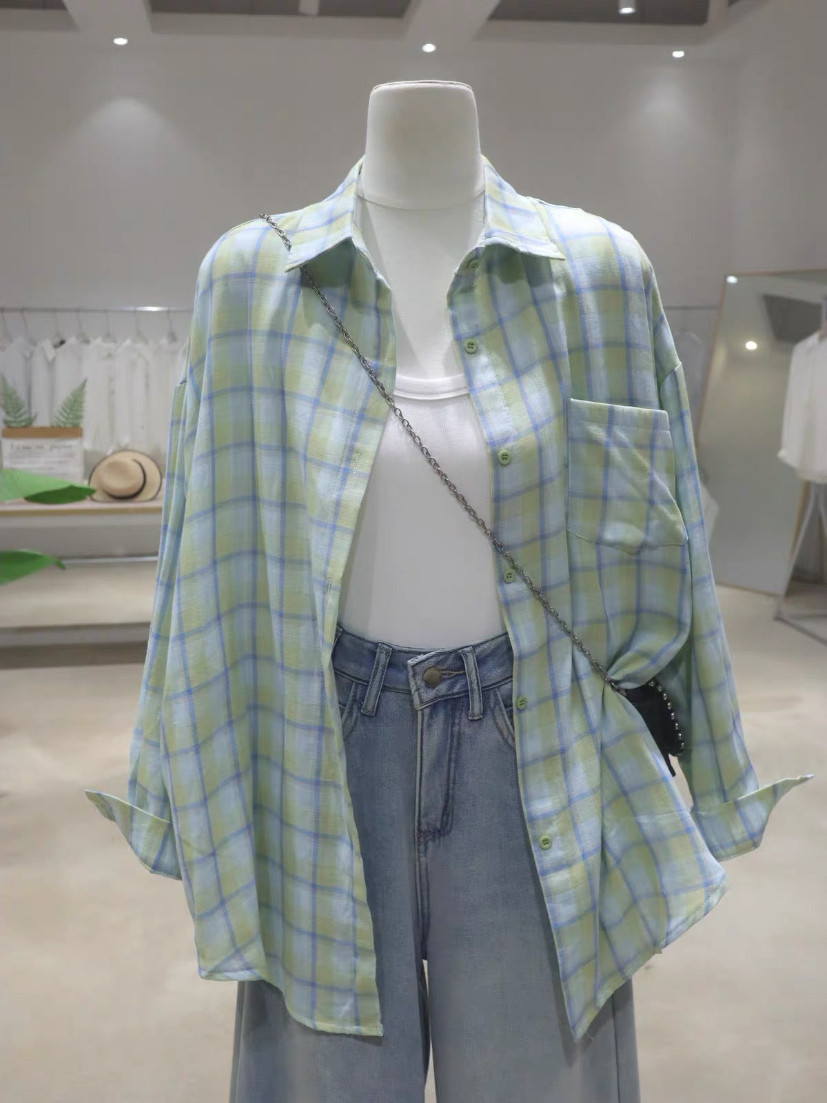 Korean-style soft, breathable, double-layered plaid cotton shirt for women—loose, mid-length, hip-covering, and long-sleeved (Summer 2026).