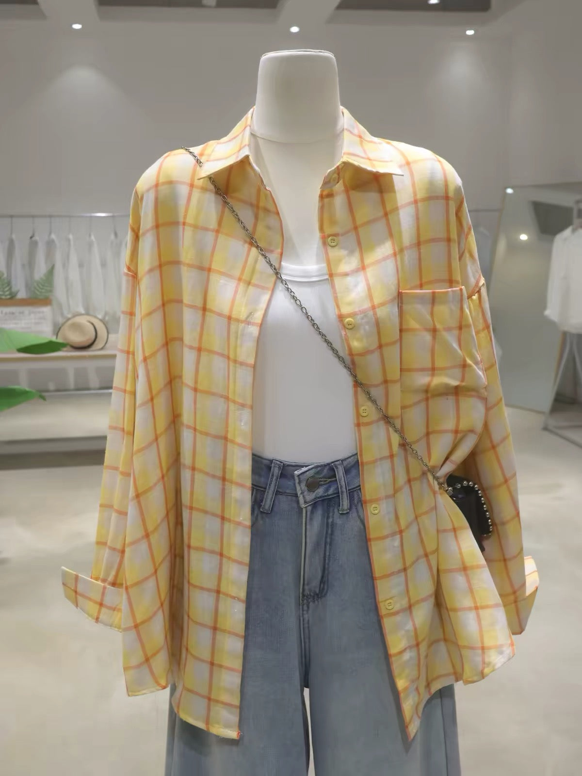 Korean-style soft, breathable, double-layered plaid cotton shirt for women—loose, mid-length, hip-covering, and long-sleeved (Summer 2026).