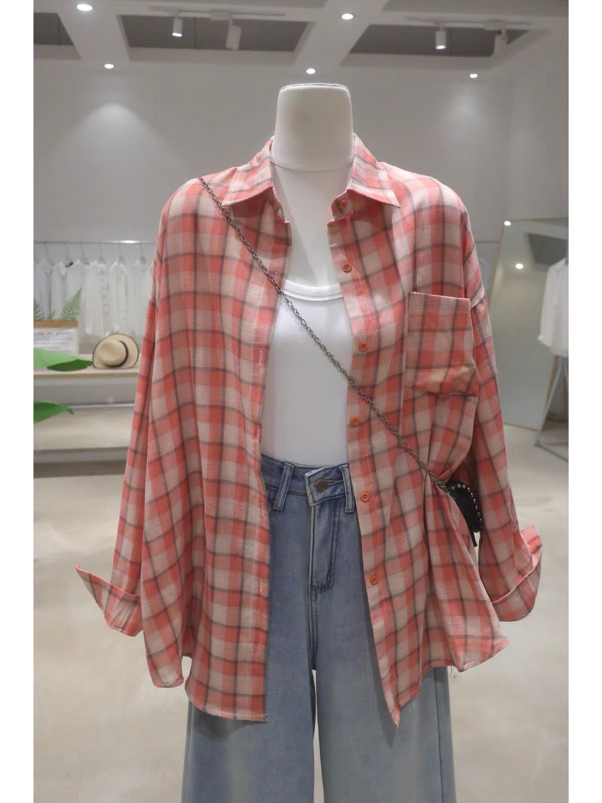Korean-style soft, breathable, double-layered plaid cotton shirt for women—loose, mid-length, hip-covering, and long-sleeved (Summer 2026).