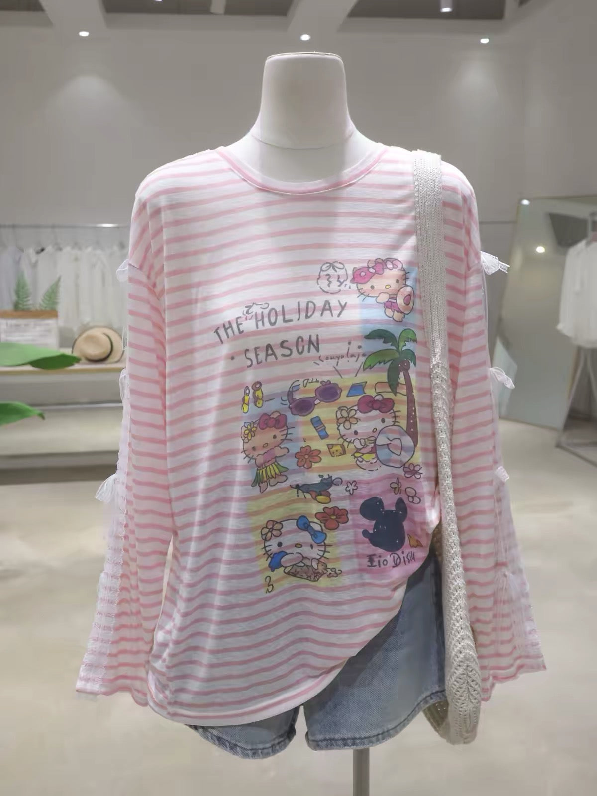 Women's Summer Loose Striped Long-Sleeve Sun-Protection T-Shirt featuring a youthful cartoon Hello Kitty design and lace-trimmed bow sleeves (2026 Collection).