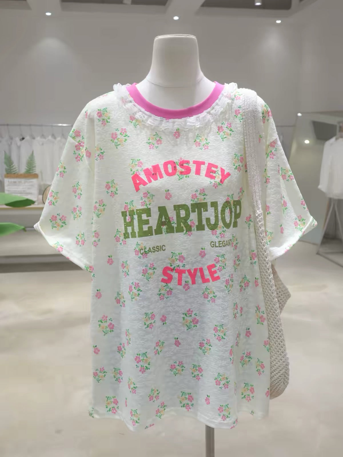 Korean-style women's short-sleeve T-shirt featuring a lace collar, floral and letter prints, and a loose, slimming, mid-length cut that covers the hips—perfect for Summer 2026.