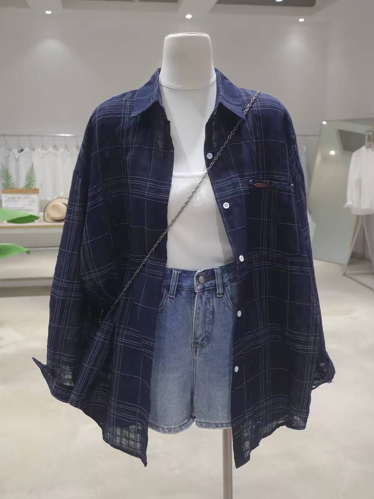 Korean-style breathable cotton plaid long-sleeve shirt for women; loose, mid-length fit; featuring elaborate, dimensional letter embroidery (Summer 2026).