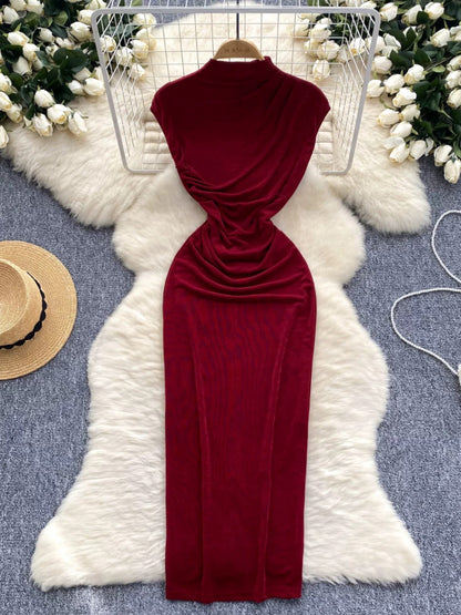 A sophisticated and elegant midi dress with a goddess-like aura, featuring subtle pleats that accentuate the waist and create a slimming effect. A European-style long bodycon dress.