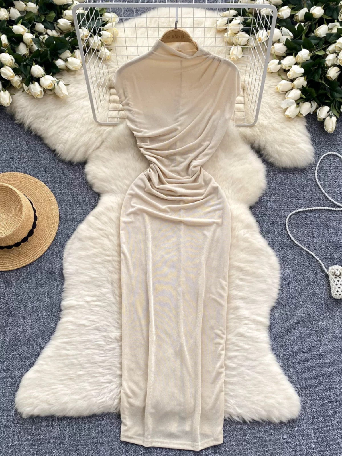 A sophisticated and elegant midi dress with a goddess-like aura, featuring subtle pleats that accentuate the waist and create a slimming effect. A European-style long bodycon dress.