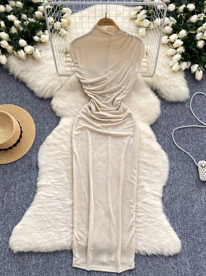 A sophisticated and elegant midi dress with a goddess-like aura, featuring subtle pleats that accentuate the waist and create a slimming effect. A European-style long bodycon dress.