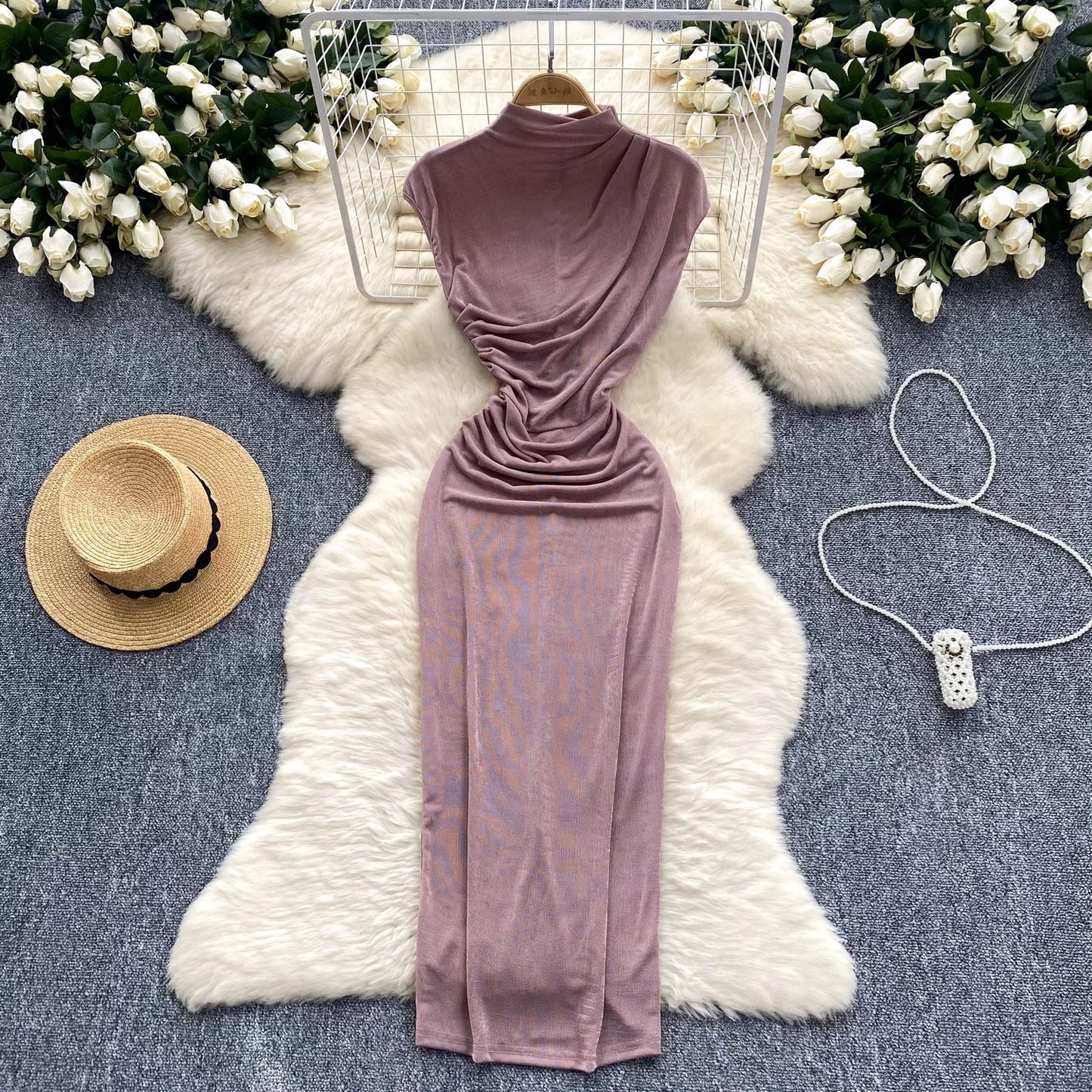 A sophisticated and elegant midi dress with a goddess-like aura, featuring subtle pleats that accentuate the waist and create a slimming effect. A European-style long bodycon dress.