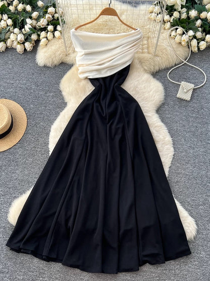 French goddess style, high-end color-blocked shawl, waist-cinching, slimming, elegant off-the-shoulder black dress