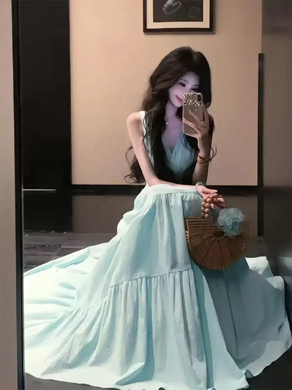 A beautiful, sophisticated, and elegant mint green French-style dress perfect for early summer, perfect for a beach vacation.