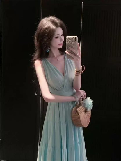 A beautiful, sophisticated, and elegant mint green French-style dress perfect for early summer, perfect for a beach vacation.