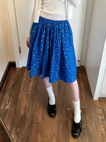 Korean style retro floral print midi skirt, new spring/summer style, high-waisted A-line, casual, unique design, flowing and versatile.