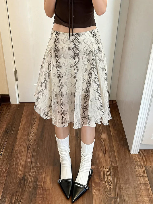 Plus-size women's snake print midi skirt, high-waisted, elegant A-line, versatile, irregular midi skirt, perfect for spring and summer.