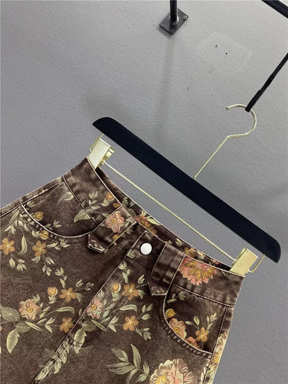 Retro brown printed denim midi skirt for women, new summer 2026, elegant high-waisted, slimming A-line bodycon mini skirt.