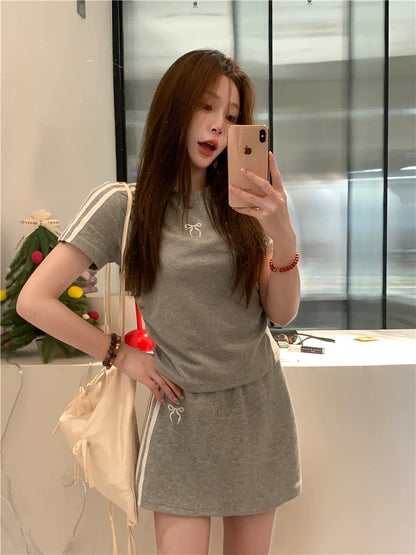 Casual sports suit for women, three-bar bow short-sleeved T-shirt, summer hip skirt, sweet girl two-piece suit