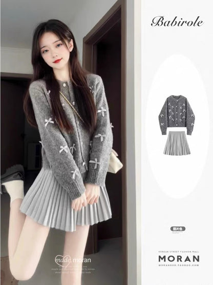 Korean-style chic short cardigan and short sweater set with unique bow design, perfect for petite women in spring and autumn.