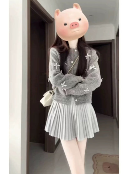 Korean-style chic short cardigan and short sweater set with unique bow design, perfect for petite women in spring and autumn.