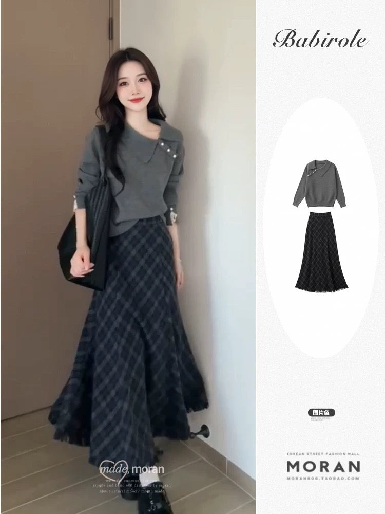 Korean-style autumn/winter outfit: a retro-chic gray sweater and plaid skirt two-piece set.